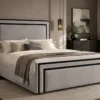 Auro Valtier bed showing the double black inset trim across the headboard and footboard