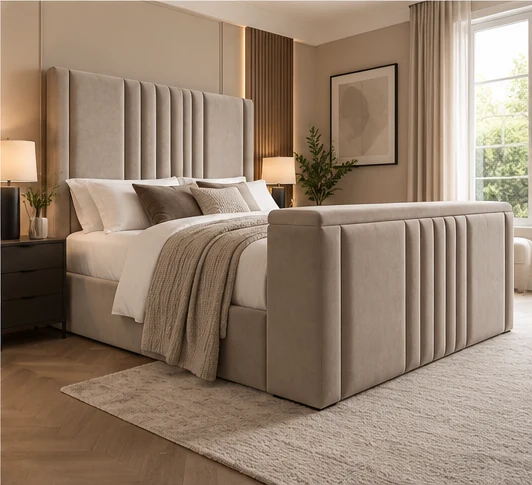 Auro Sora upholstered TV bed shown in a warm contemporary bedroom setting.