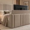 Auro Sora upholstered TV bed with the television raised from the footboard.